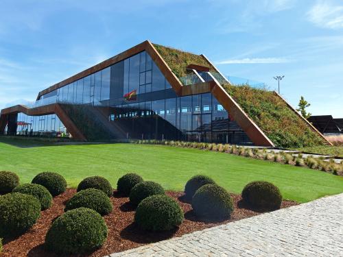 Modern building with glass facades and a green roof