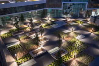 Illuminated roof garden in the courtyard at night