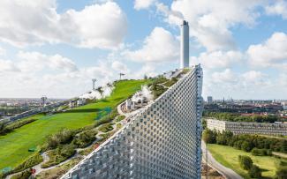 Steep pitched green roof with grass and hiking paths